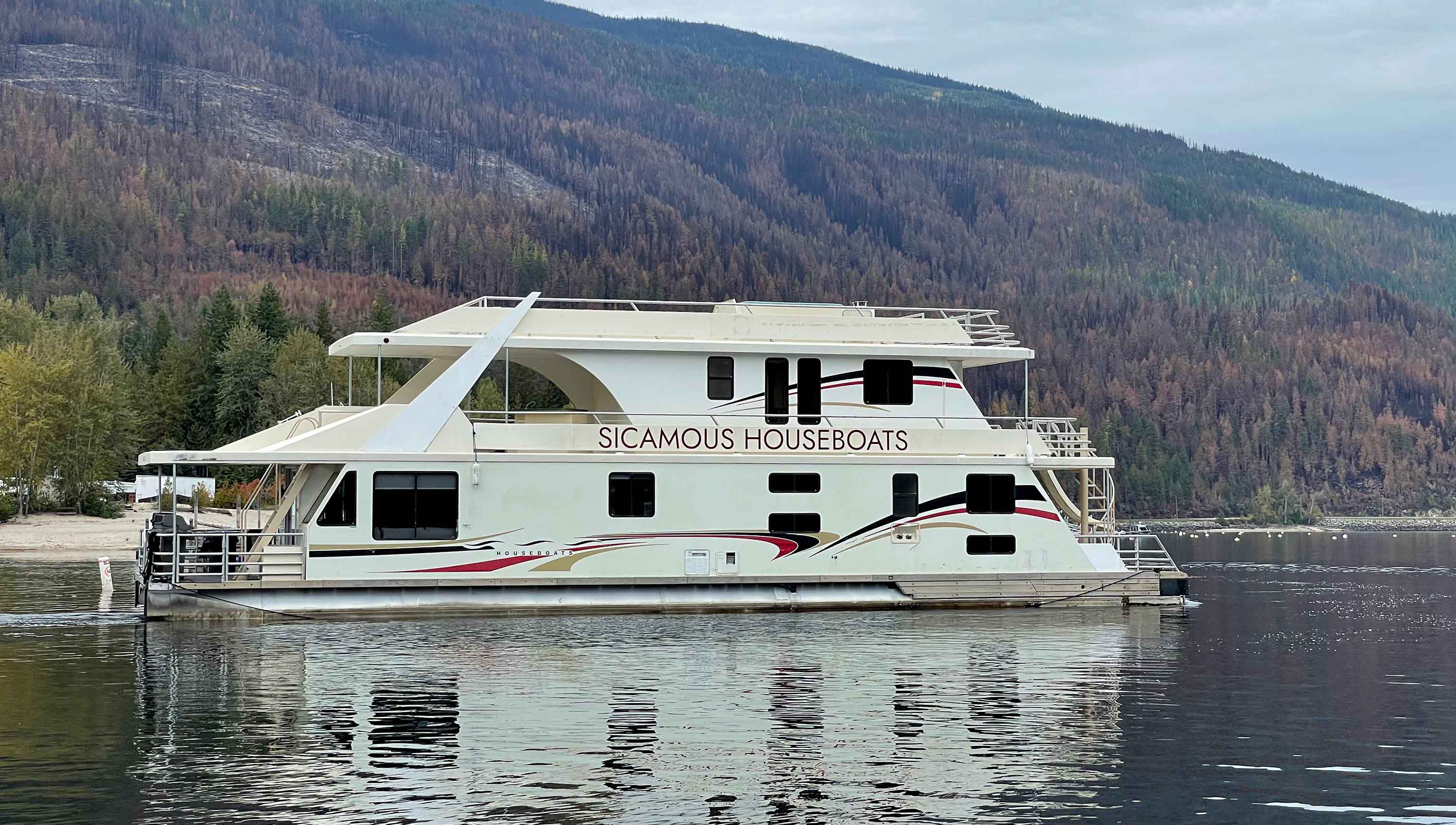The Mirage 66 towing a speed boat in the middle of Schuswap lake.
